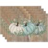 Artoid Mode Orange Pumpkins Eucalyptus Leaves Fall Placemats Set of 4, 12×18 Inch Seasonal Autumn Table Mats for Party Kitchen Dining Decoration(Blue Leaves/Wood)