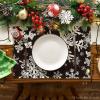 Artoid Mode Green Snowflakes Christmas Placemats for Dining Table, 12 x 18 Inch Seasonal Winter Washable Table Mats Set of 4(Black)