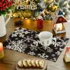Artoid Mode Green Snowflakes Christmas Placemats for Dining Table, 12 x 18 Inch Seasonal Winter Washable Table Mats Set of 4(Black)