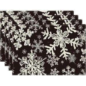 Artoid Mode Green Snowflakes Christmas Placemats for Dining Table, 12 x 18 Inch Seasonal Winter Washable Table Mats Set of 4(Black)