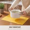 Artoid Mode Green Faux Leather Placemats Set of 4, 15 Inch Waterproof Wipeable Heat Resistant Vinyl Place Mats, Reversible Table Mats for St. Patrick’s Day Dining Decor(Yellow)