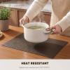 Artoid Mode Green Faux Leather Placemats Set of 4, 15 Inch Waterproof Wipeable Heat Resistant Vinyl Place Mats, Reversible Table Mats for St. Patrick’s Day Dining Decor(Coffee)